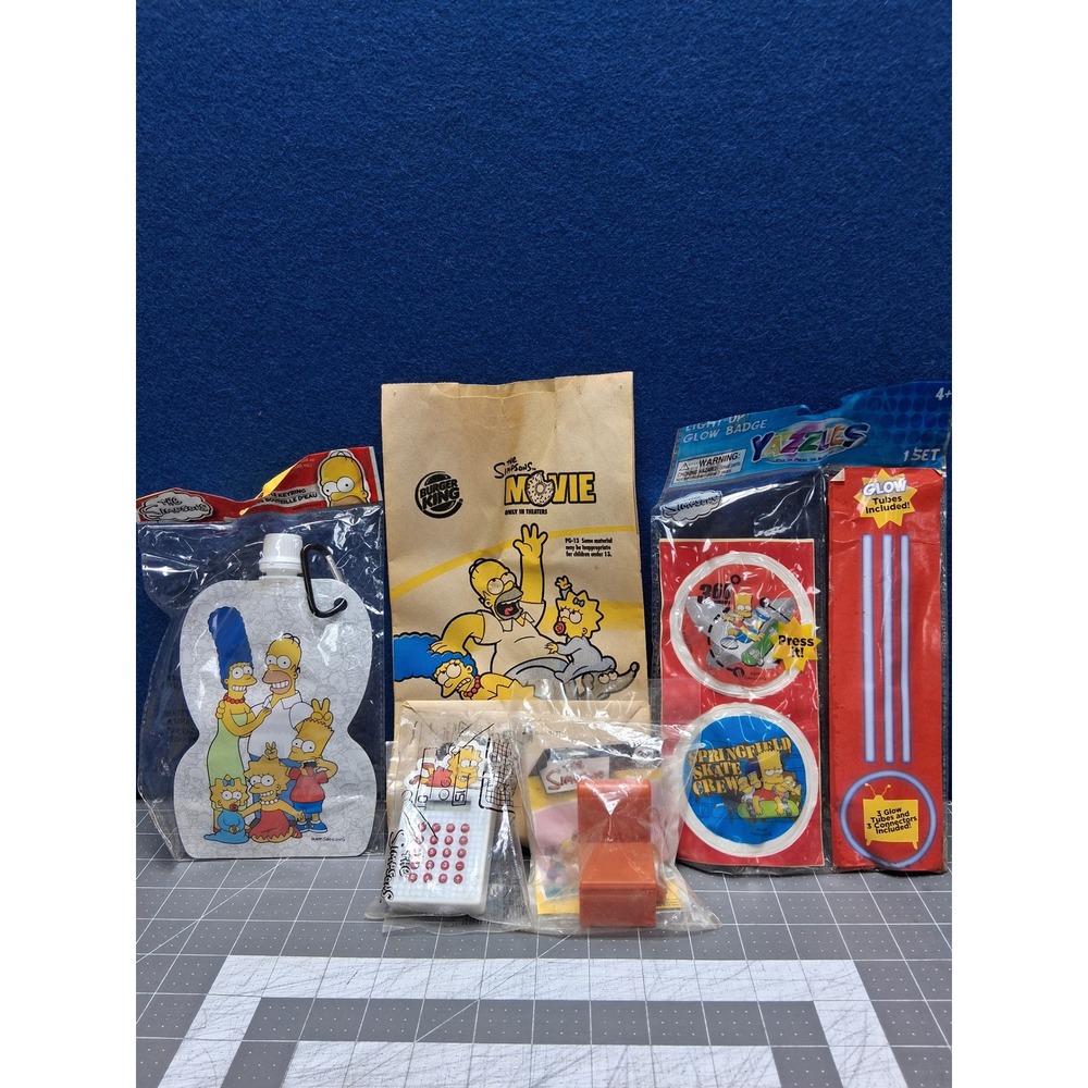The Simpsons Movie Burger King Bag Calculator Water Pouch Glow Badge Lot